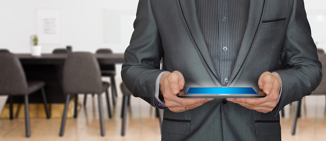 Businessman, consulting, business — The Role of Merchant ID Numbers in Securing Payment Processing Systems